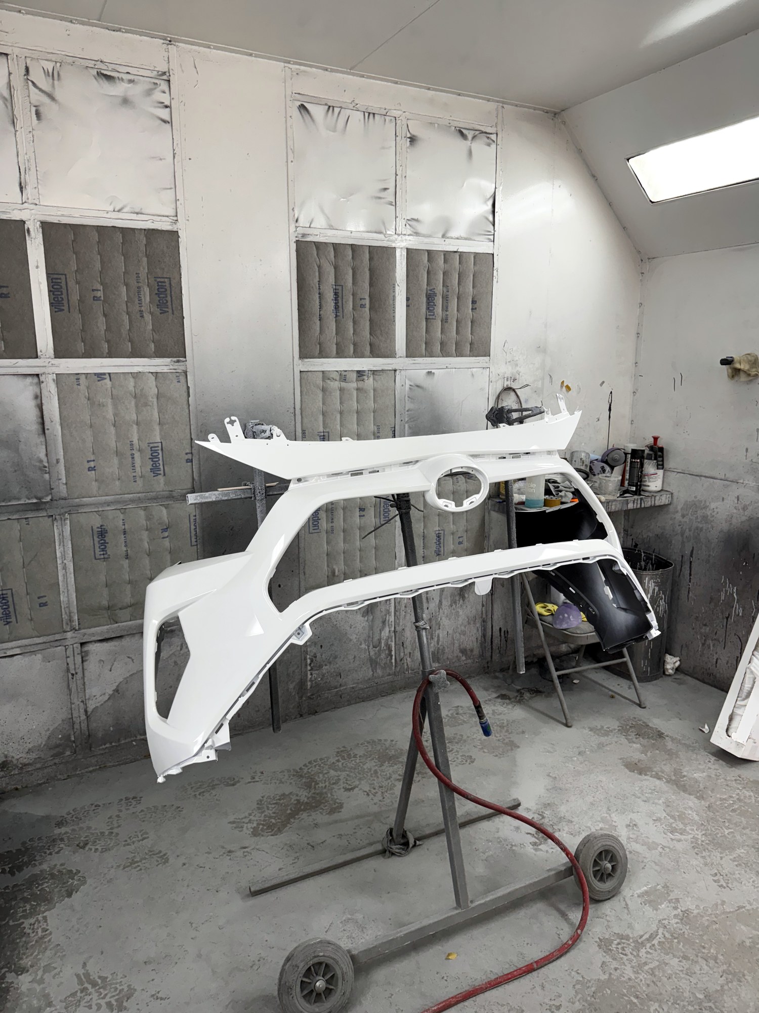 Fresh white panels on the stand in the paint booth